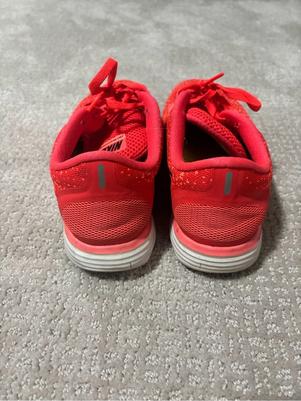 Nike Women's Neon Orange Sneakers with Black Swoosh